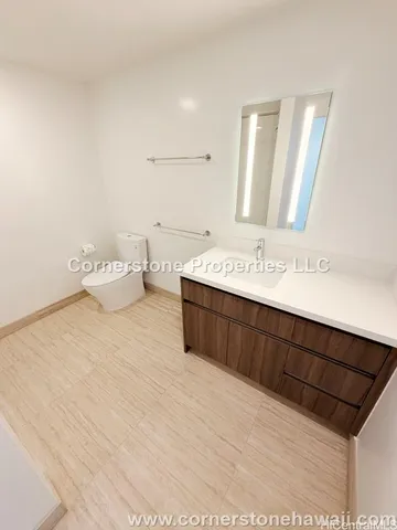 a bathroom with a sink vanity and a mirror