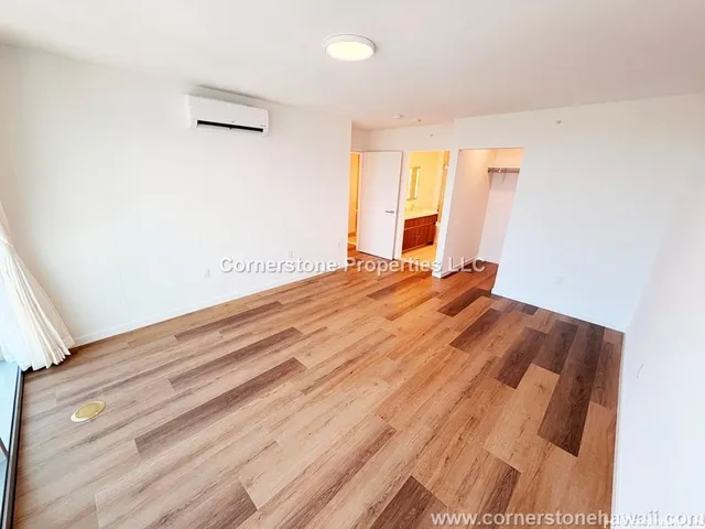 a room with a bed and a window