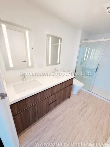 a bathroom with a sink a mirror and a shower