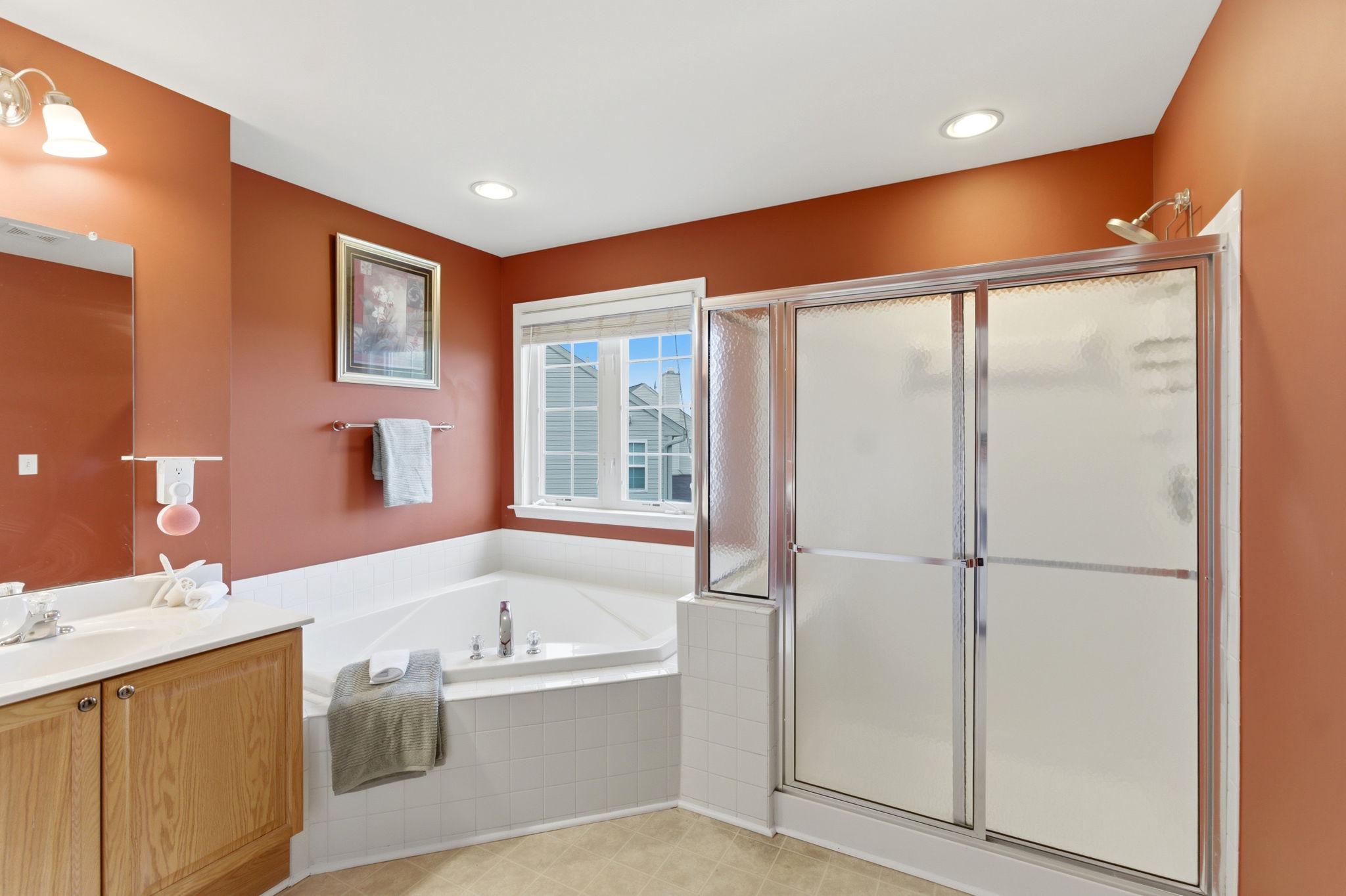 457 Hughs Road Charles Town, WV 25414 - Photo 31 of 73 Serene main bathroom with warm hues.