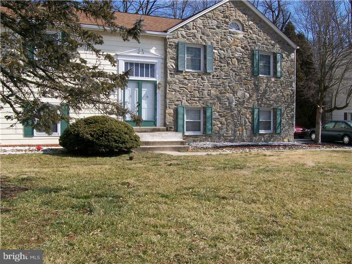 449 Doe Run Lane Springfield, PA 19064 - Photo 1 of 11 a front view of a house with a yard