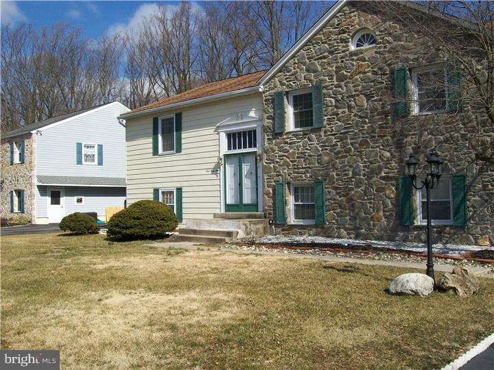 449 Doe Run Lane Springfield, PA 19064 - Photo 2 of 11 a view of a house with backyard and sitting area