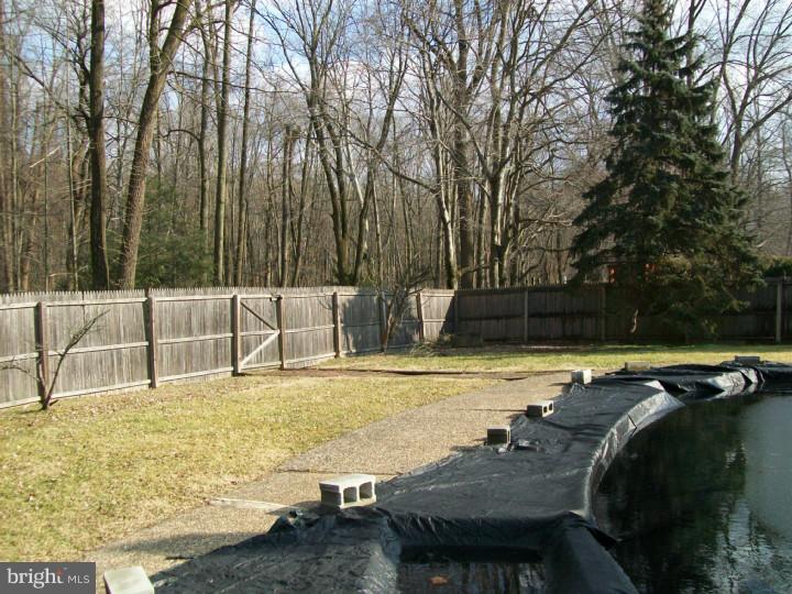 449 Doe Run Lane Springfield, PA 19064 - Photo 11 of 11 a view of a swimming pool with a lounge chair