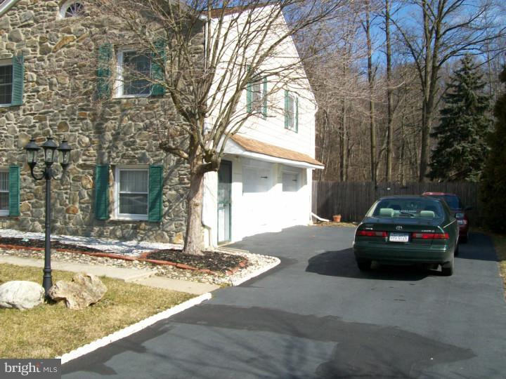 449 Doe Run Lane Springfield, PA 19064 - Photo 10 of 11 a view of a car parked in front of a house