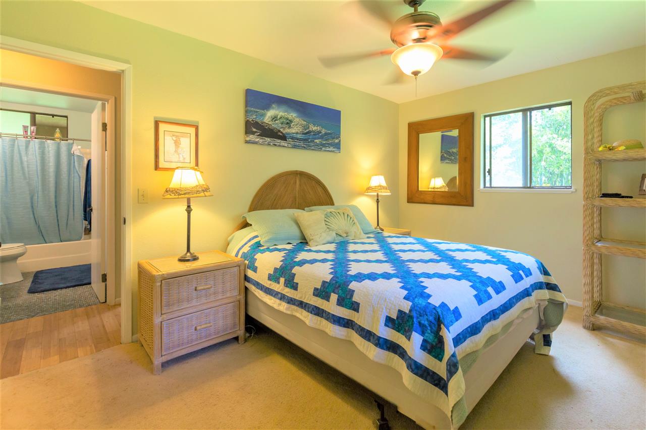 4025 Lower Honoapiilani Road Lahaina, HI 96761 - Photo 15 of 21 a bed sitting in a bedroom next to a window