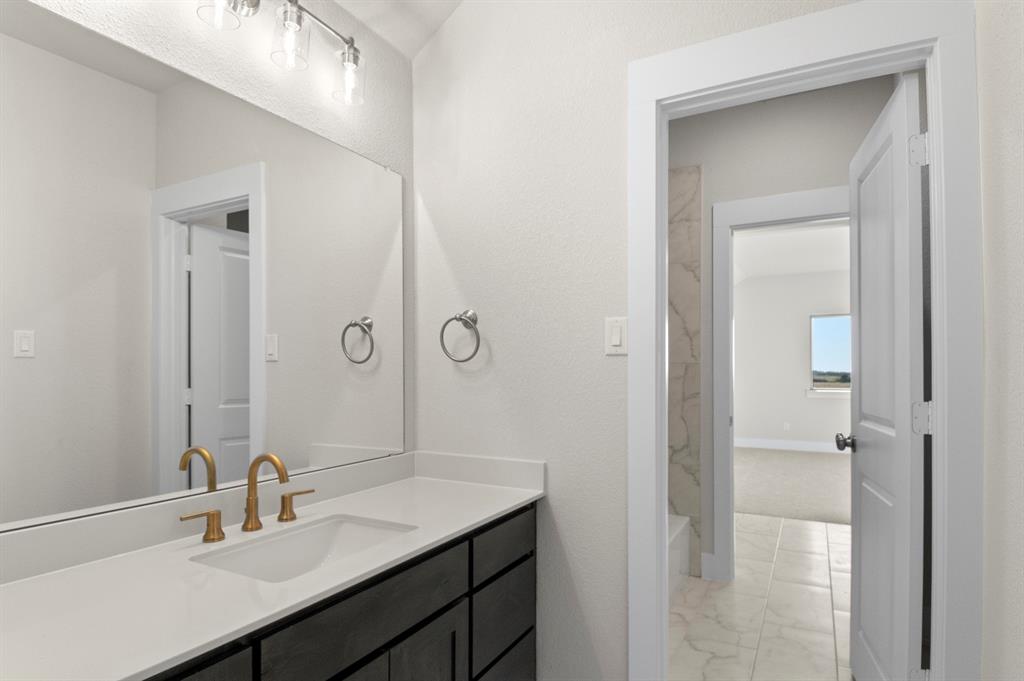 2131 Holborn Street Waco, TX 76655 - Photo 26 of 31 a bathroom with a sink double vanity and a mirror