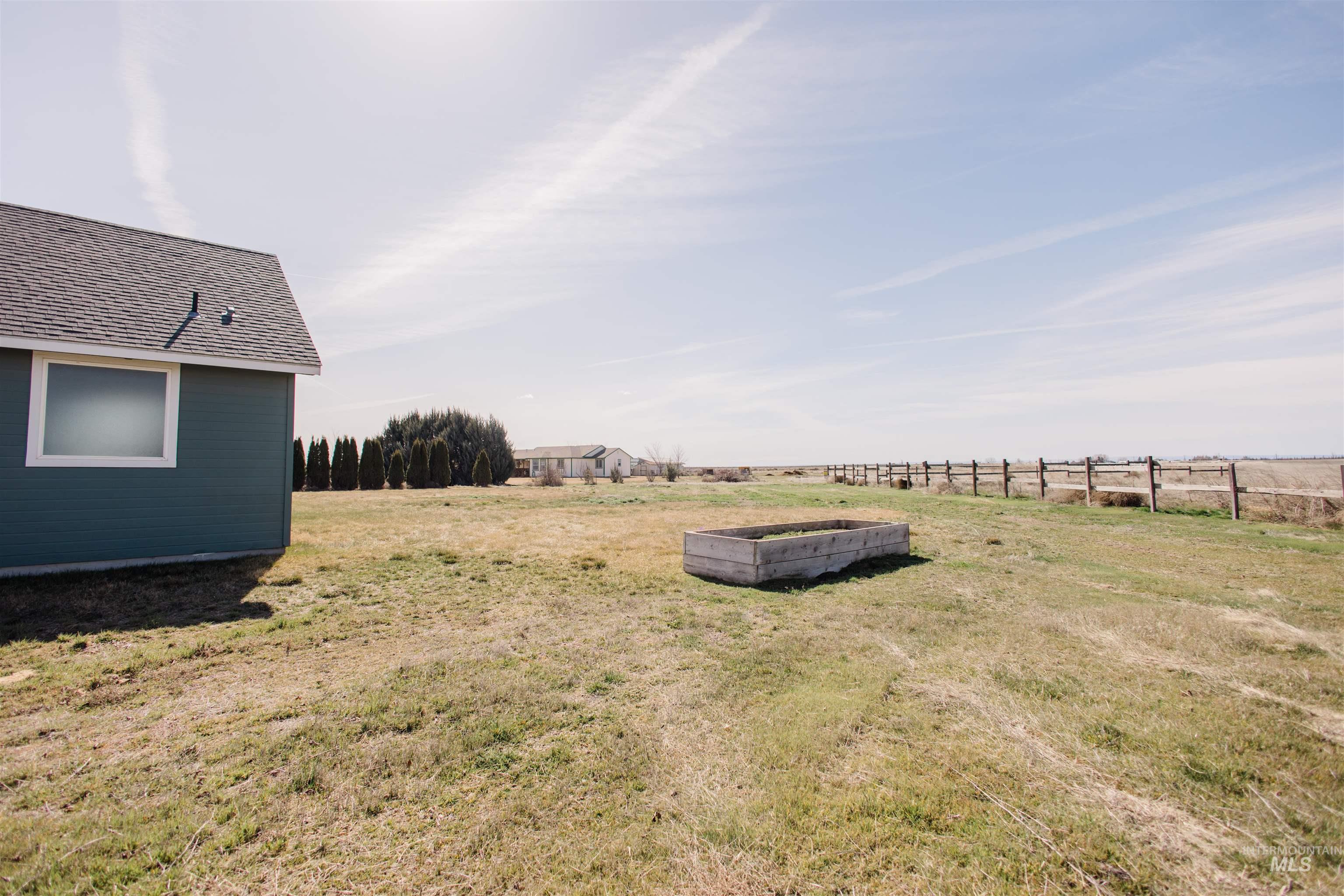 1571 Southeast Hamilton Road Mountain Home, ID 83647 - Photo 42 of 50 View of yard featuring a rural view and a vegetable garden