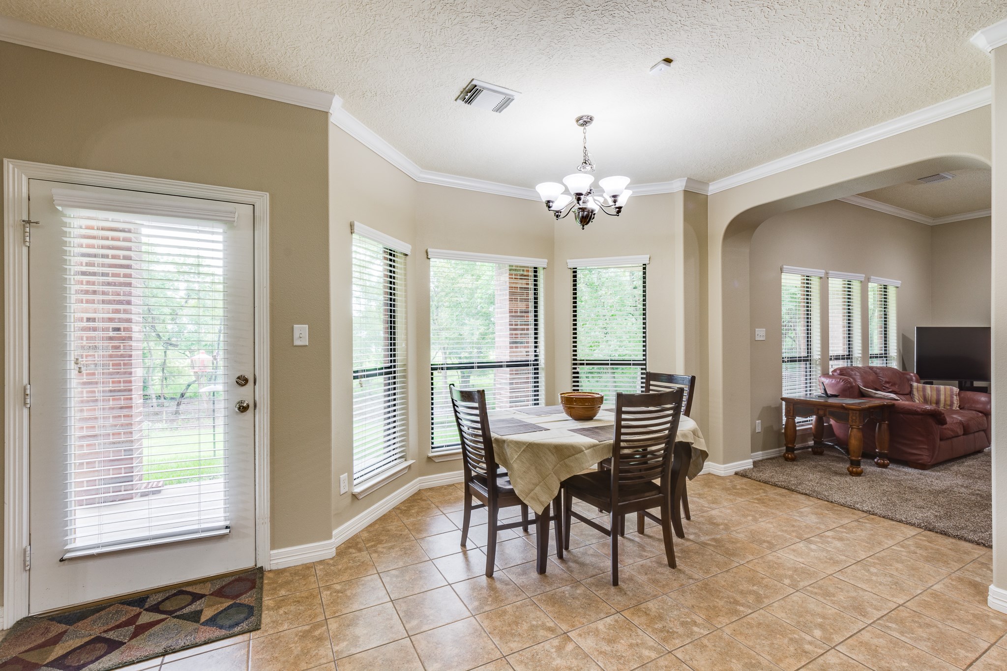 507 Oaks Grande Road Baytown, TX 77523 - Photo 17 of 50 a view of a dining room with furniture and chandelier