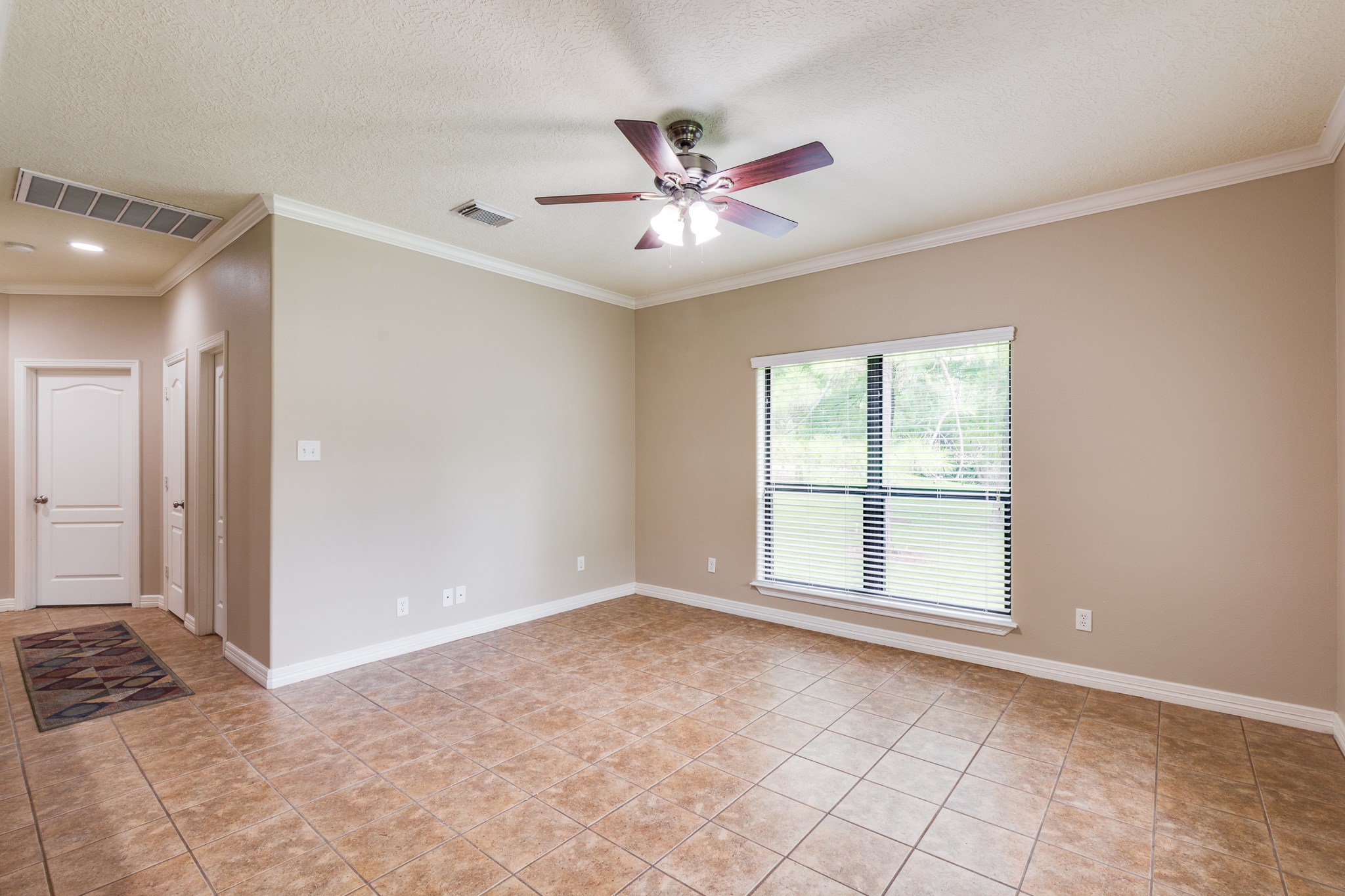 507 Oaks Grande Road Baytown, TX 77523 - Photo 21 of 50 wooden floor in an empty room with a window