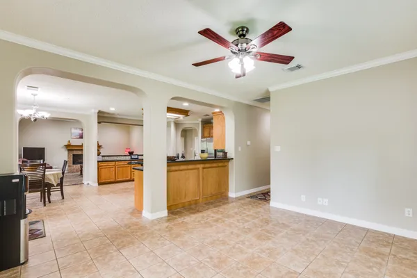 a view of a livingroom with kitchen and kitchen island