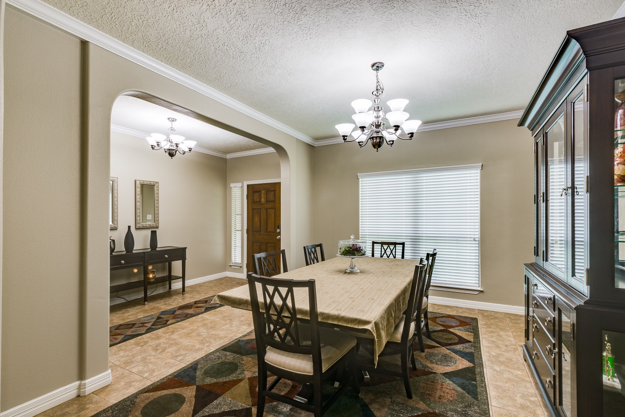 507 Oaks Grande Road Baytown, TX 77523 - Photo 23 of 50 a view of a dining room with furniture and a chandelier