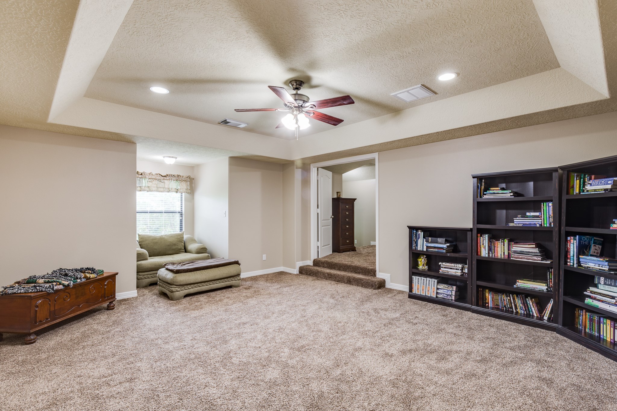 507 Oaks Grande Road Baytown, TX 77523 - Photo 26 of 50 a view of workspace with bookshelf and windows