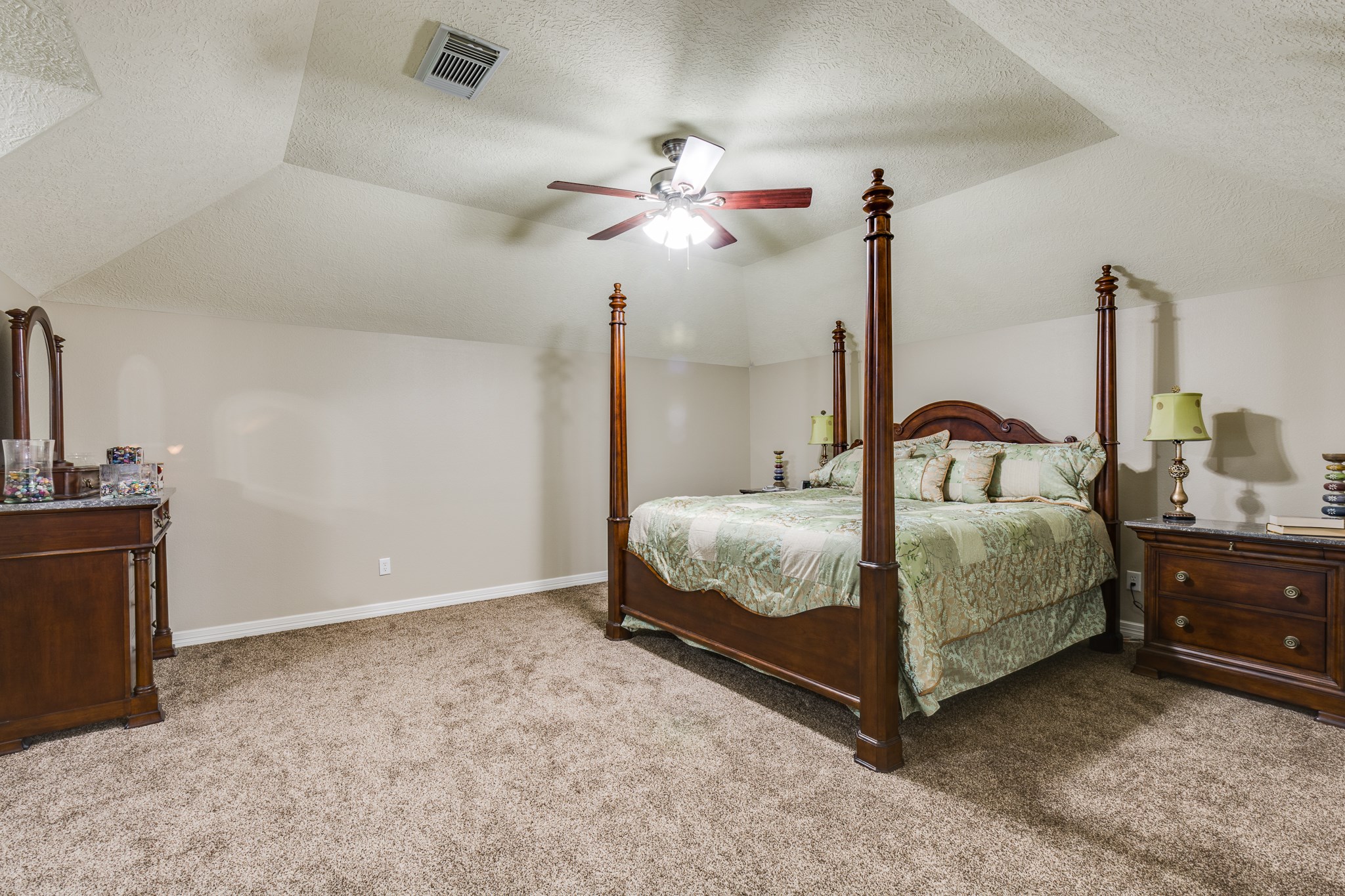 507 Oaks Grande Road Baytown, TX 77523 - Photo 28 of 50 a bedroom with a bed and a chandelier