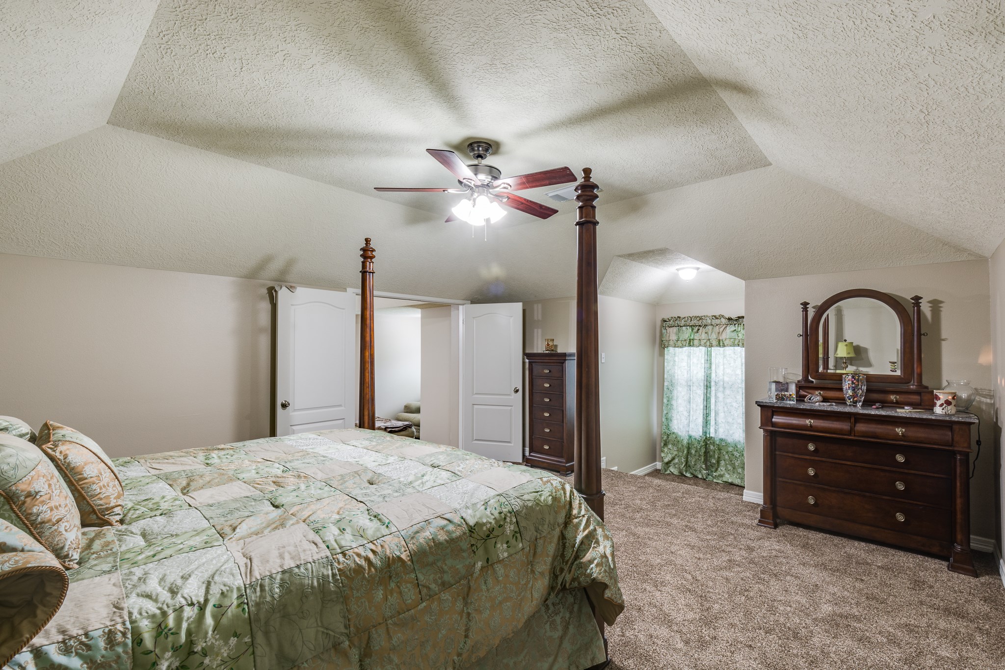 507 Oaks Grande Road Baytown, TX 77523 - Photo 29 of 50 a bedroom with a bed and a dresser