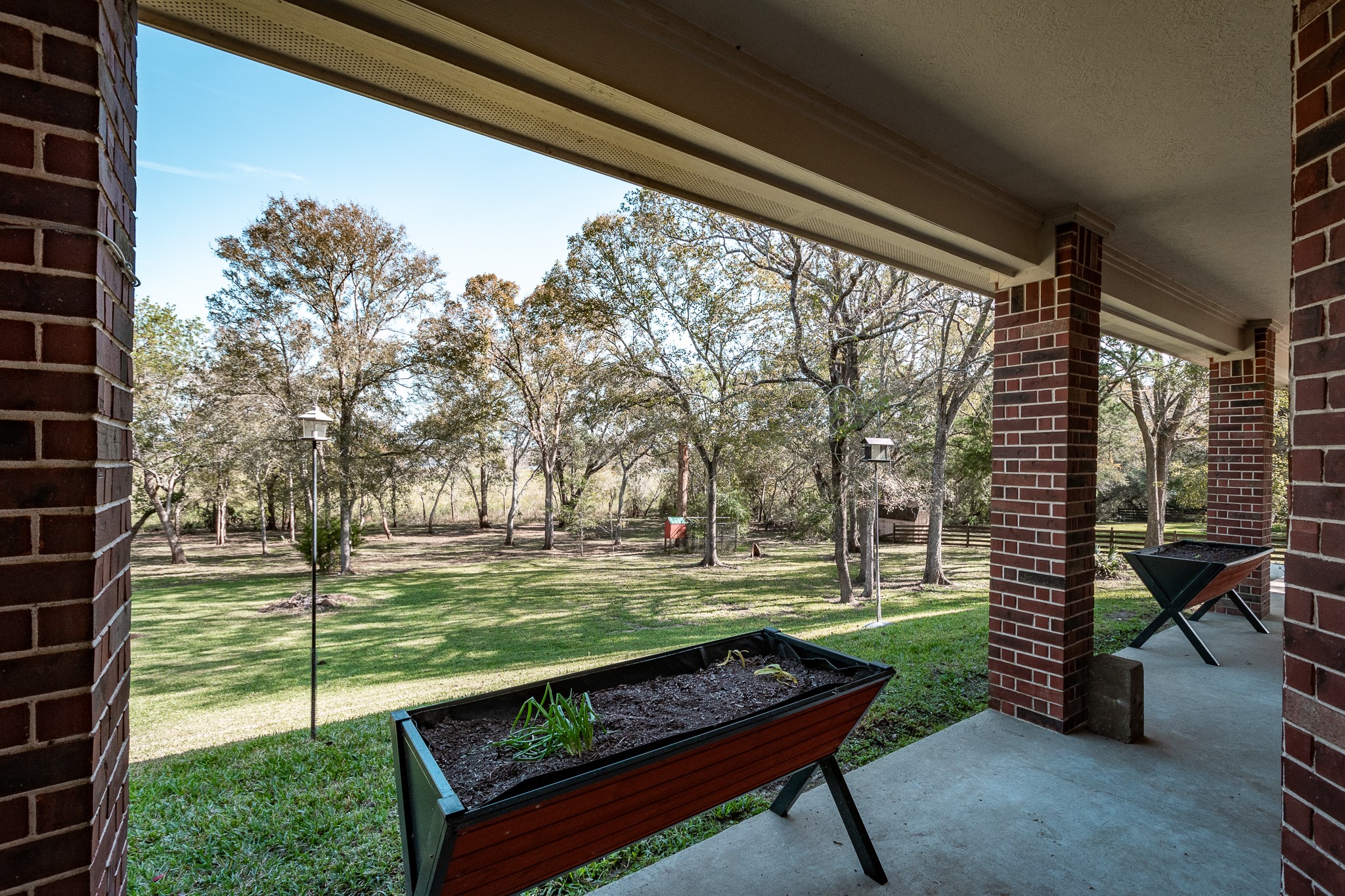 507 Oaks Grande Road Baytown, TX 77523 - Photo 44 of 50 a garden view with a sitting space