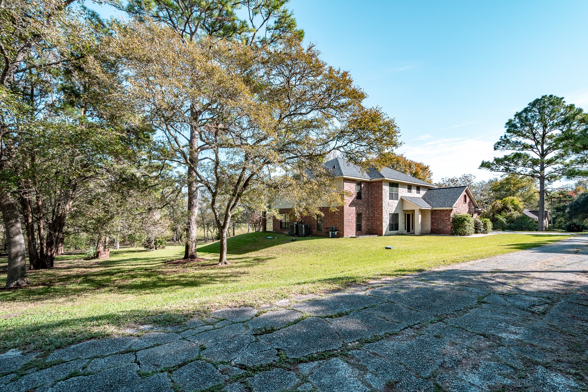 507 Oaks Grande Road Baytown, TX 77523 - Photo 50 of 50 a big house with trees in front of it