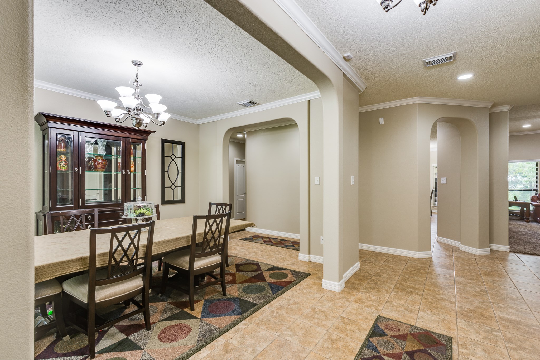 507 Oaks Grande Road Baytown, TX 77523 - Photo 7 of 50 a view of a dining room with furniture and chandelier