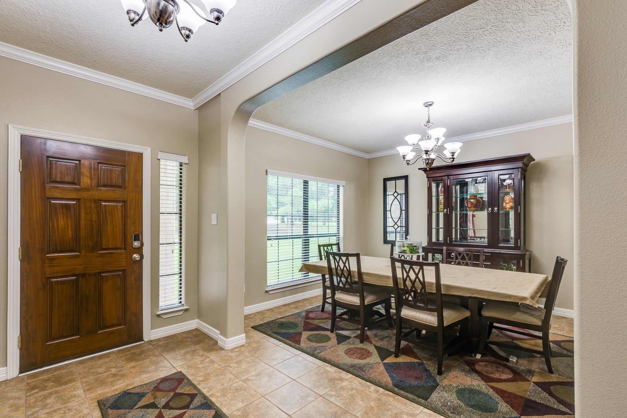 507 Oaks Grande Road Baytown, TX 77523 - Photo 8 of 50 a view of a dining room with furniture and chandelier