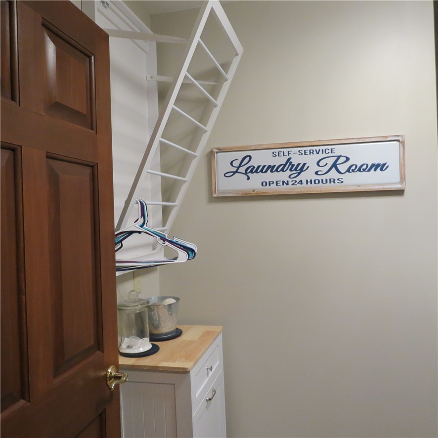10160 Lochard Road Sidney, OH 45365 - Photo 28 of 41 This practical laundry room offers convenience and essential functionality for daily tasks.