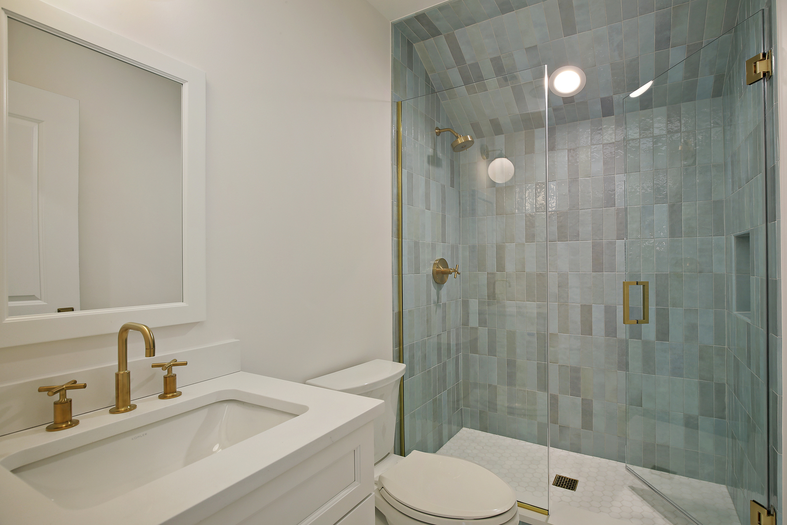 517 Cumnor Road Kenilworth, IL 60043 - Photo 13 of 24 a bathroom with a sink a toilet and shower