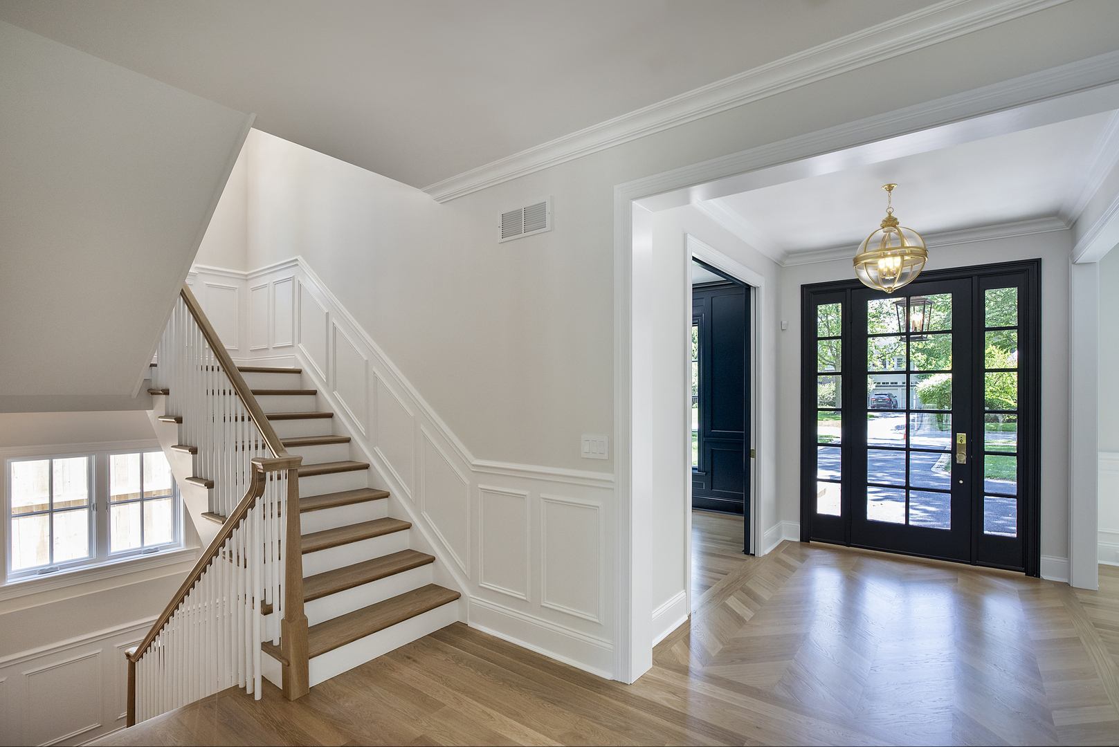 517 Cumnor Road Kenilworth, IL 60043 - Photo 2 of 24 a view of an entryway with wooden floor and stairs
