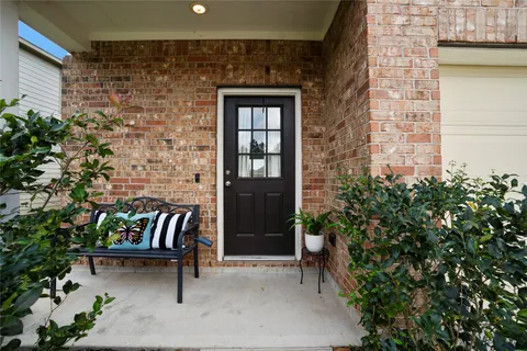 a outdoor living space with furniture and a potted plant