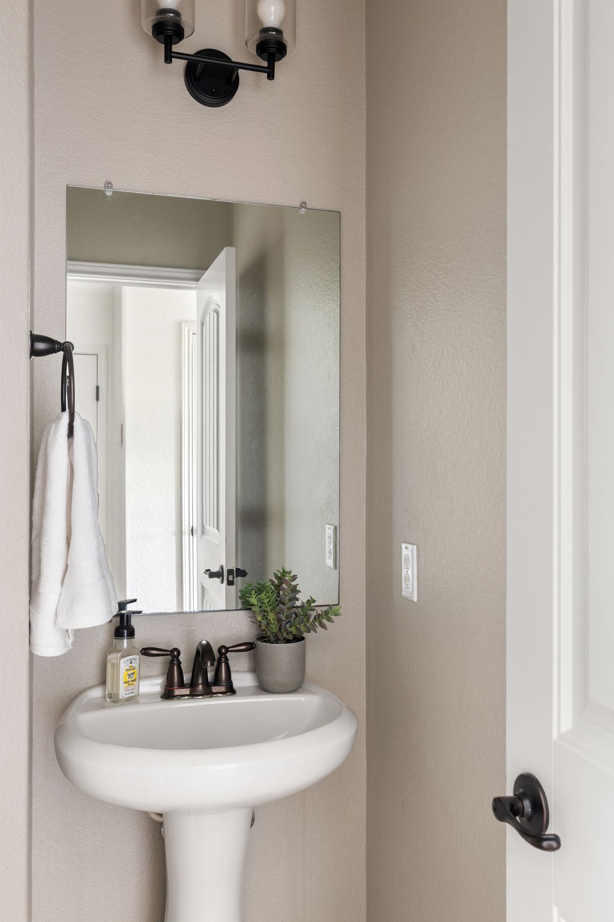 407 Stone View Trail Austin, TX 78737 - Photo 20 of 40 a bathroom with a sink and a mirror