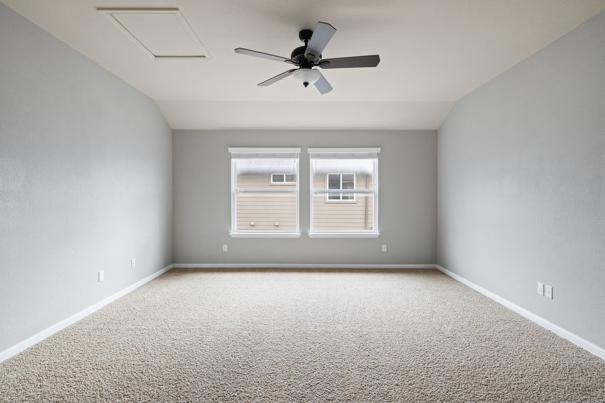 407 Stone View Trail Austin, TX 78737 - Photo 29 of 40 an empty room with windows and fan