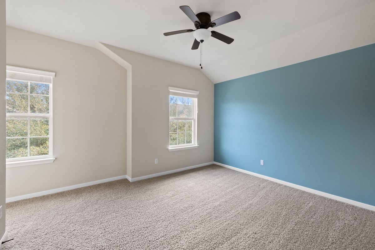 407 Stone View Trail Austin, TX 78737 - Photo 30 of 40 a view of room with a ceiling fan and window