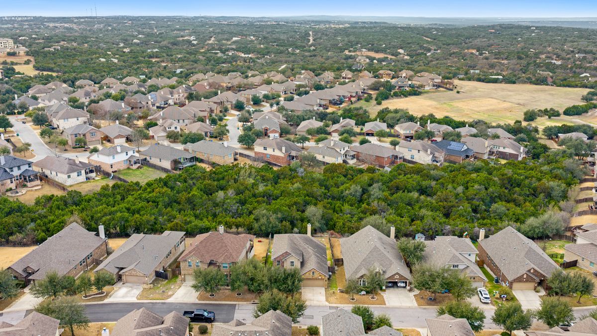 407 Stone View Trail Austin, TX 78737 - Photo 3 of 40 an aerial view of residential houses with city view