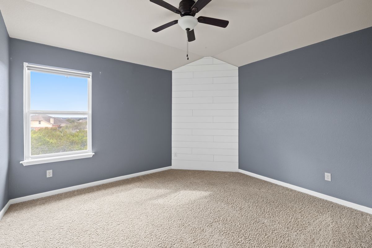 407 Stone View Trail Austin, TX 78737 - Photo 32 of 40 a view of an empty room with a window