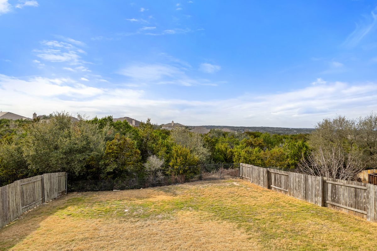 407 Stone View Trail Austin, TX 78737 - Photo 38 of 40 a view of a swimming pool with a yard