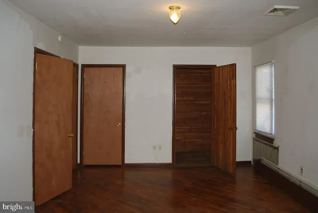 a bathroom with a sink a mirror and a toilet