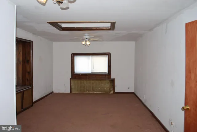 a view of a room with a hallway