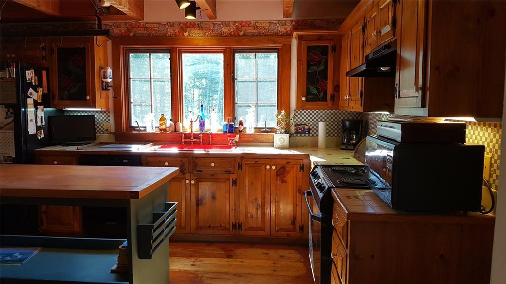 721 Deering Ridge Road Waterboro, ME 04030 - Photo 18 of 32 Large window with cheery red sink...