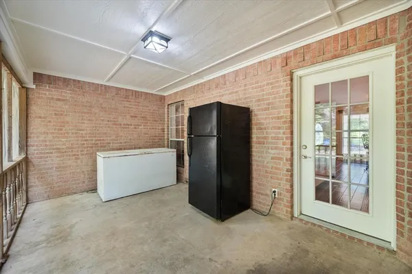 a view of an empty room with a fireplace
