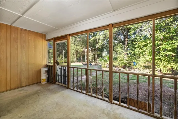 a view of a room with large windows