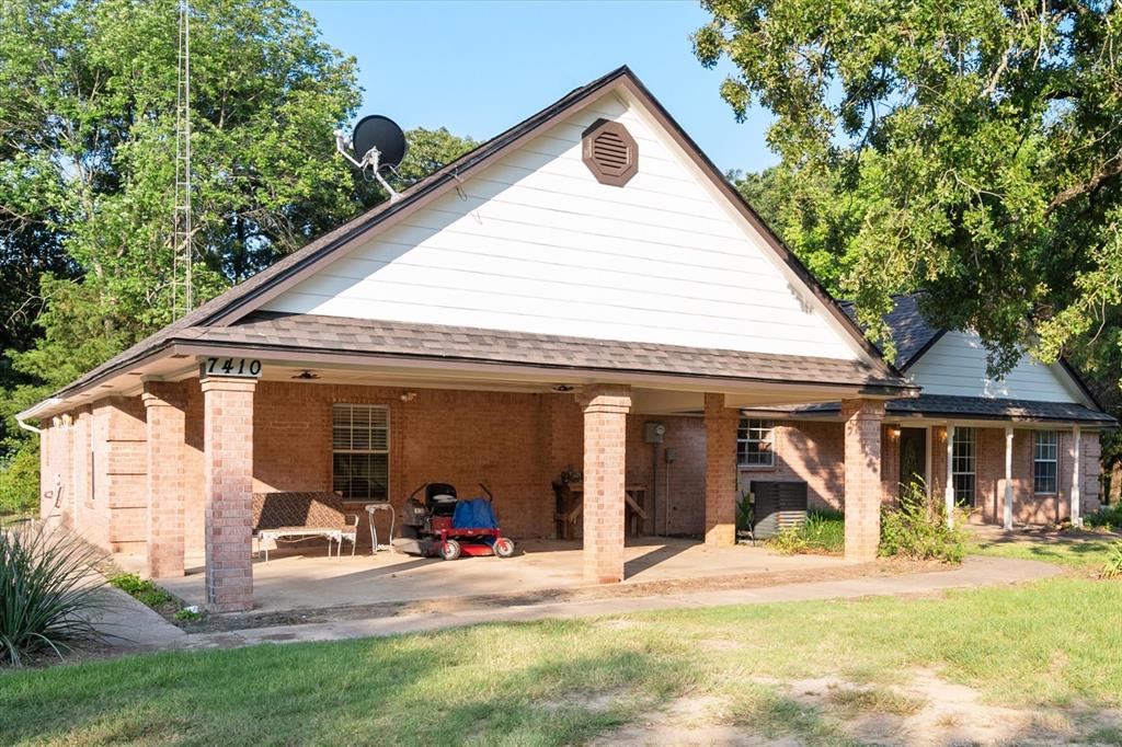 7410 County Road Kerens, TX 75144 - Photo 3 of 35 a view of a house with backyard porch and sitting area