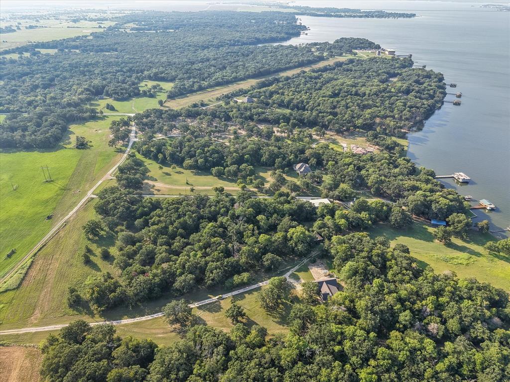 7410 County Road Kerens, TX 75144 - Photo 34 of 35 a view of a garden with a lake