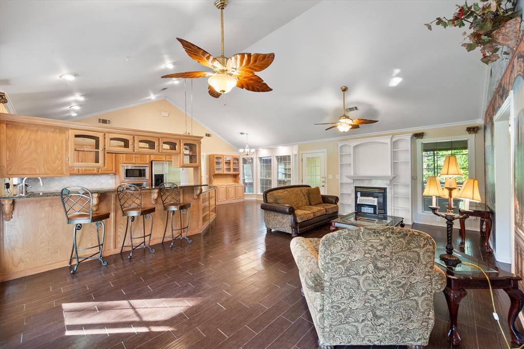 7410 County Road Kerens, TX 75144 - Photo 5 of 35 a living room with furniture a dining table and chairs to ceiling window with wooden floor
