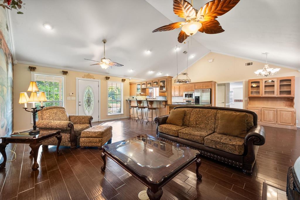 7410 County Road Kerens, TX 75144 - Photo 8 of 35 a living room with furniture ceiling fan and a rug