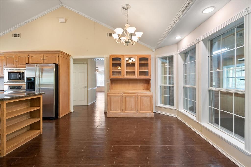 7410 County Road Kerens, TX 75144 - Photo 10 of 35 a view of an empty room with window and wooden floor