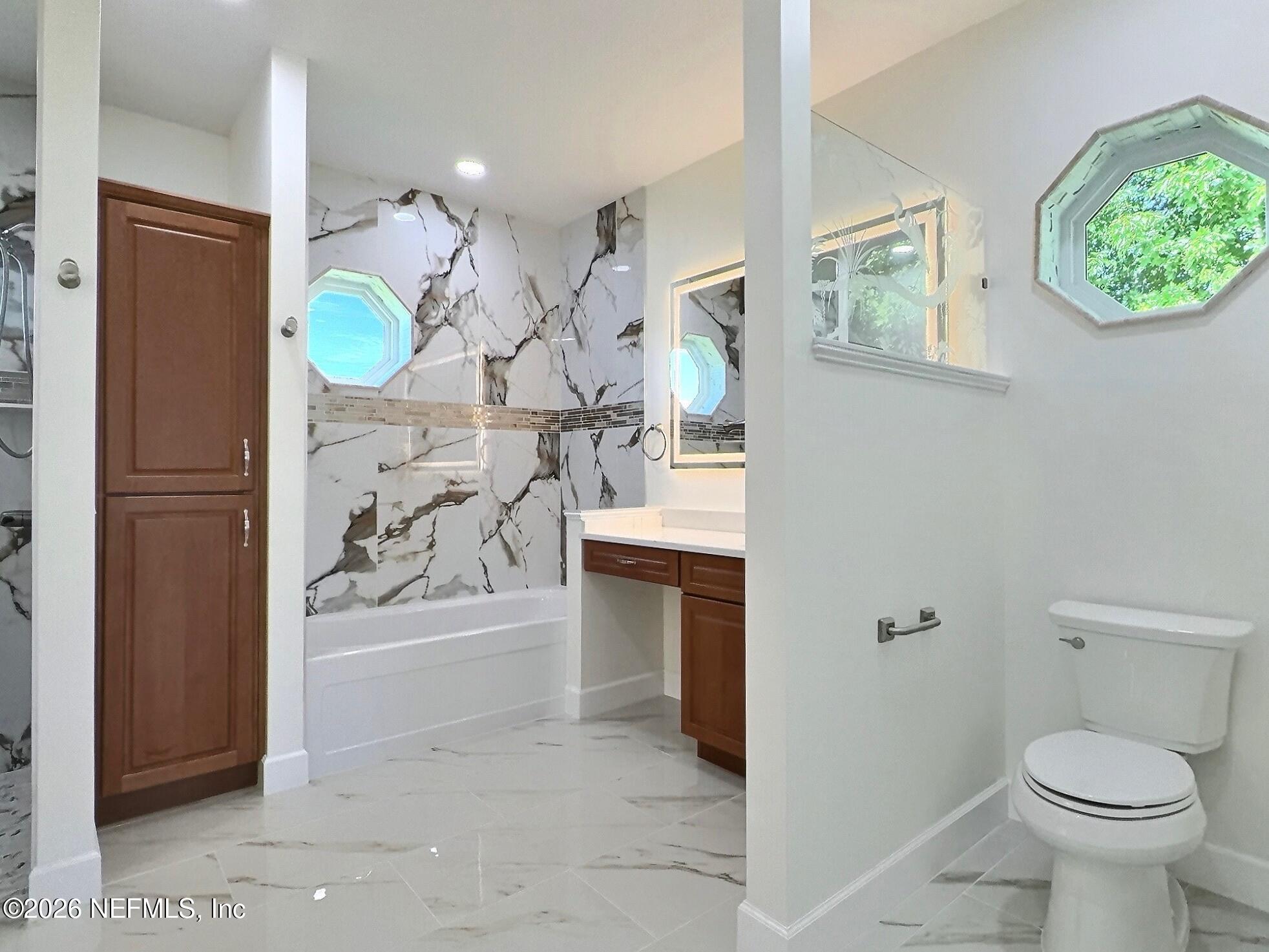 159 Mays Cove Road East Palatka, FL 32131 - Photo 24 of 62 a bathroom with a toilet sink and mirror