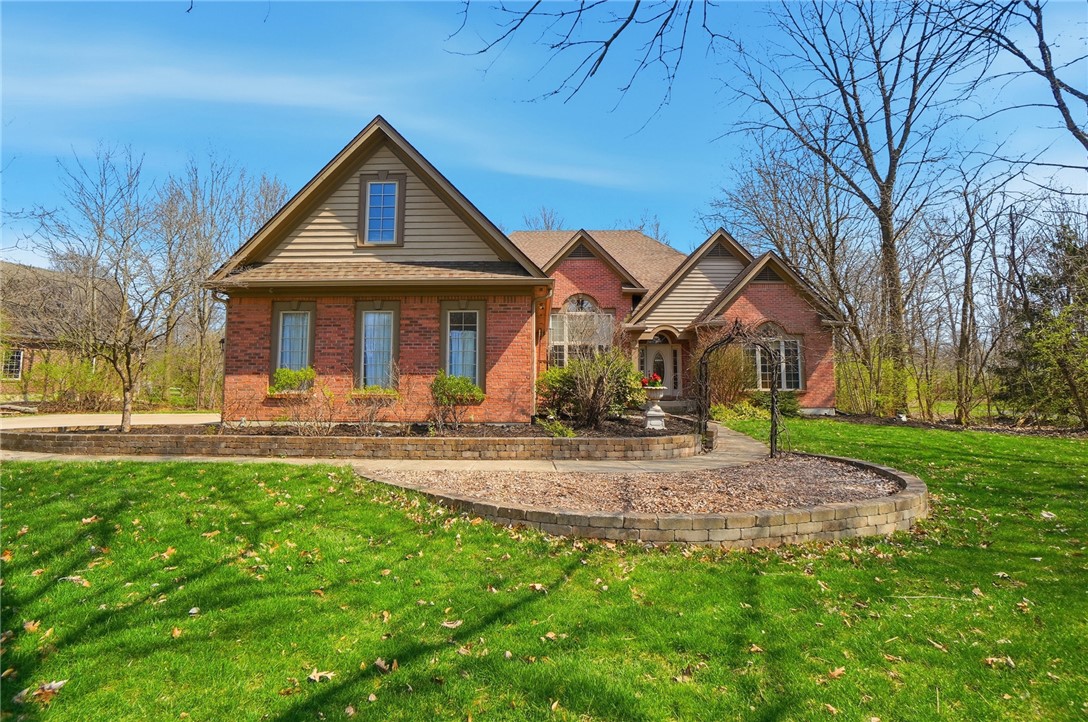 472 Timber Walk Court Springboro, OH 45066 - Photo 64 of 86 This classic brick residence features an inviting exterior with a manicured lawn and mature landscaping.