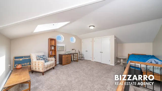 a bedroom with furniture and a window