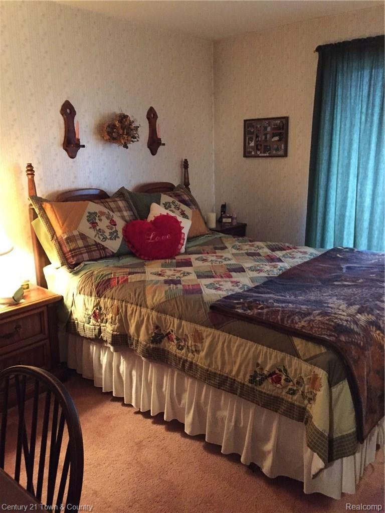 308 North Rochester Road, Unit 8 Clawson, MI 48017 - Photo 7 of 11 Queen sized bed fits easily in bedroom