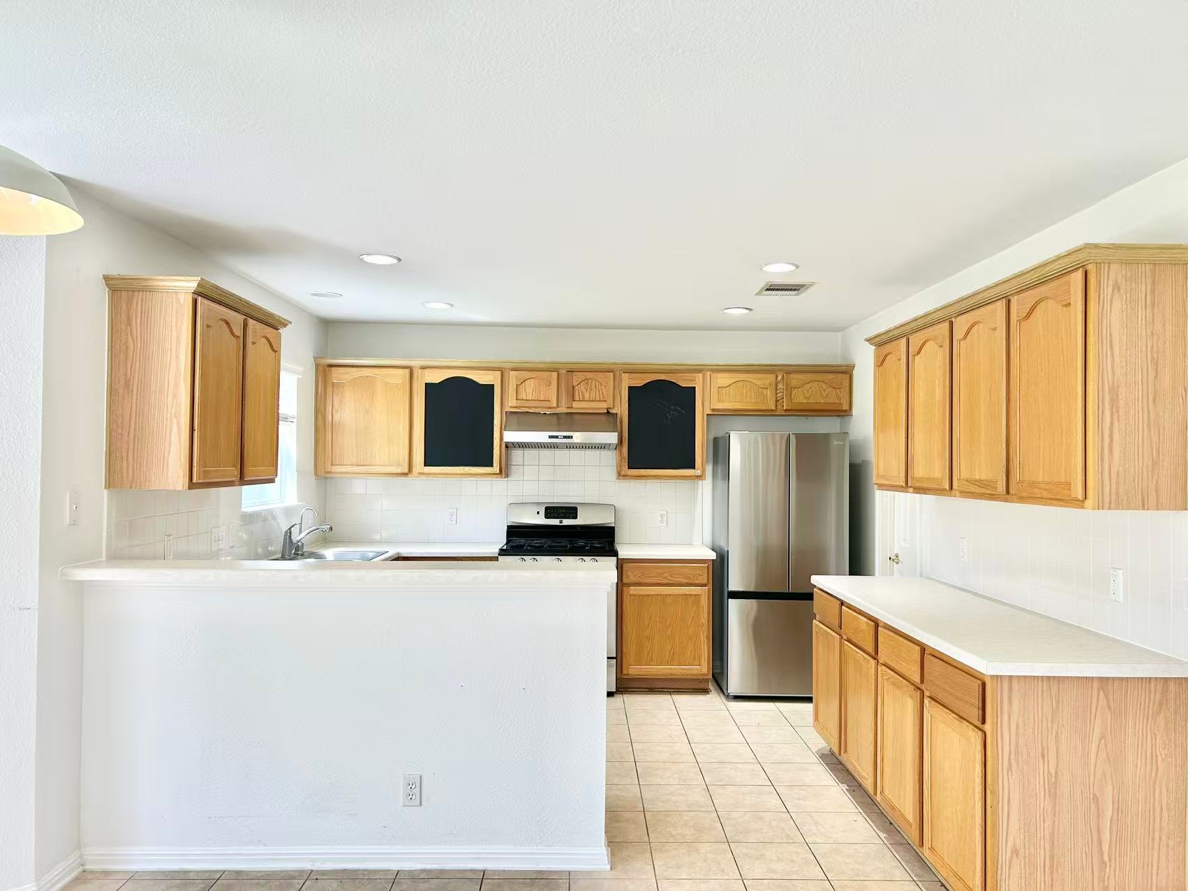5608 Netleaf Road Austin, TX 78724 - Photo 9 of 26 A well-equipped culinary space awaits with stainless steel appliances and abundant cabinetry.