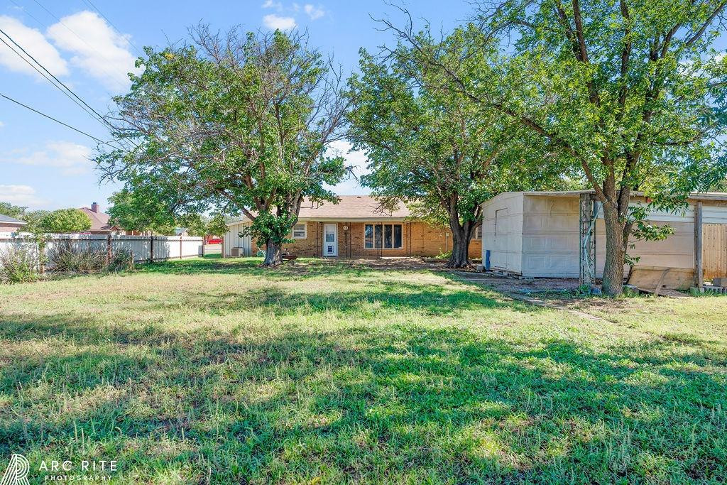 2123 North Cypress Road Lubbock, TX 79403 - Photo 22 of 22 a view of house with backyard and trees