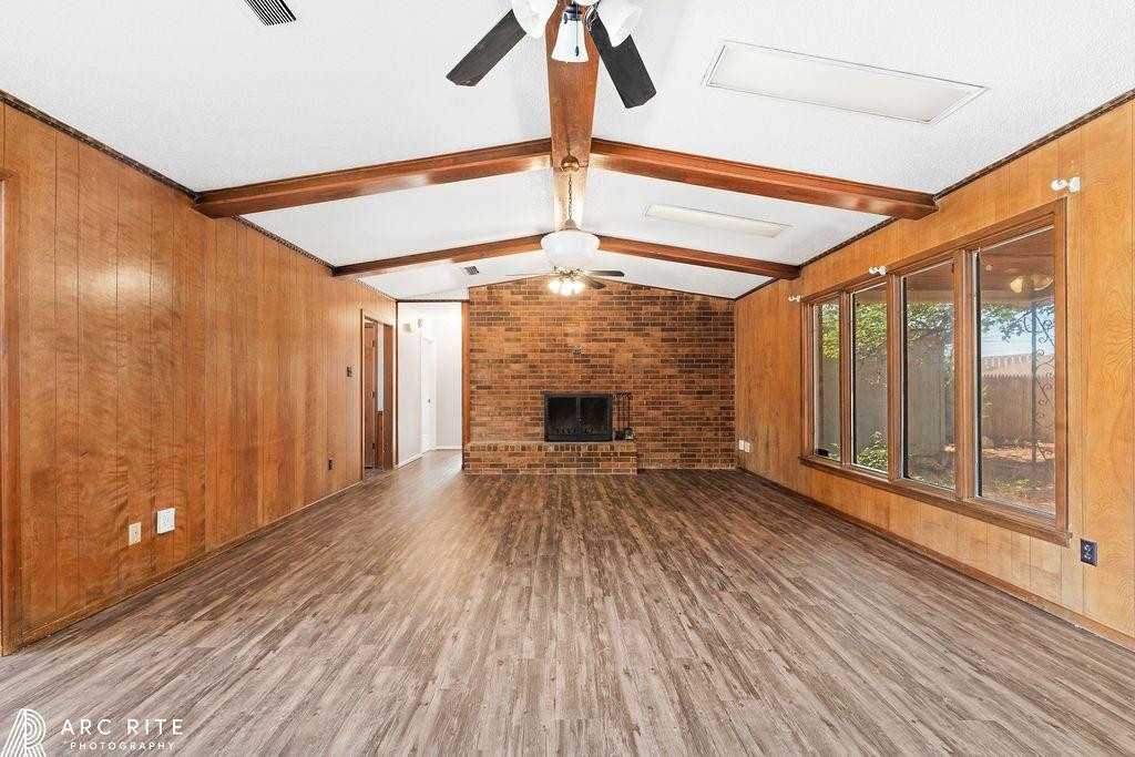 2123 North Cypress Road Lubbock, TX 79403 - Photo 3 of 22 a view of empty room with wooden floor and fan