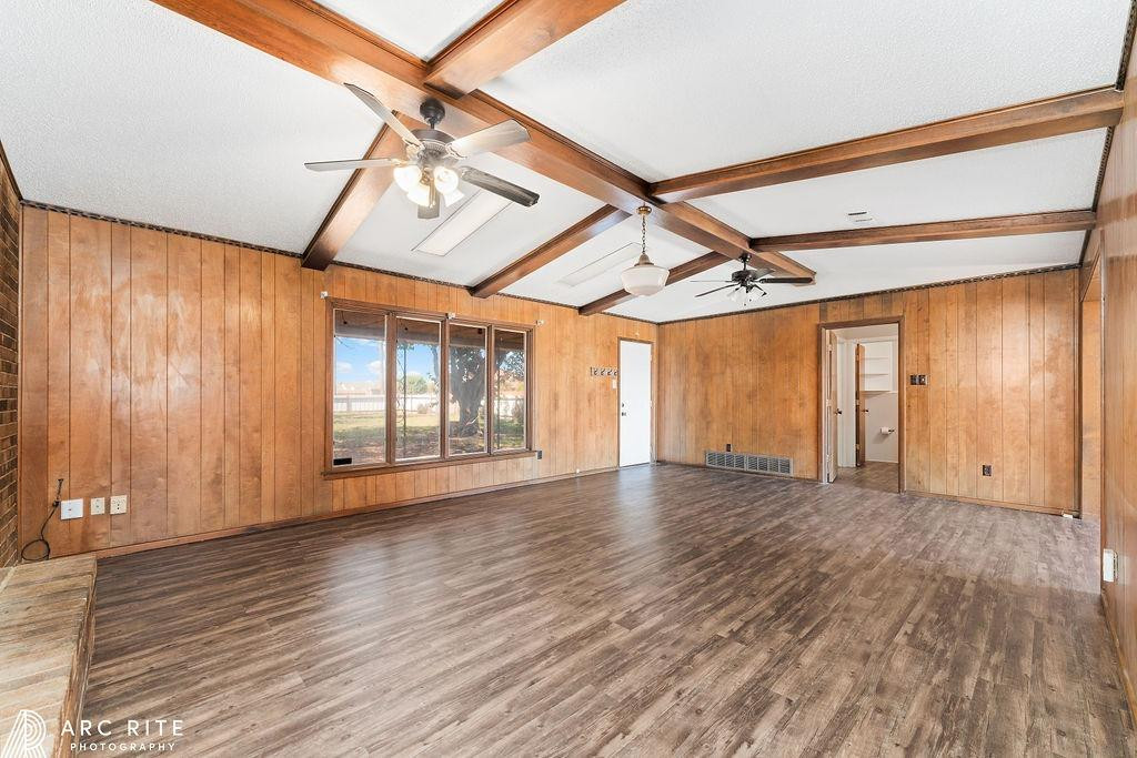 2123 North Cypress Road Lubbock, TX 79403 - Photo 5 of 22 a view of an empty room with wooden floor and fan